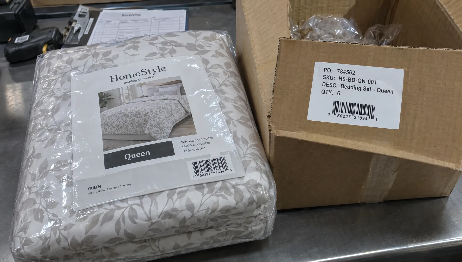 A bedding retail pack with visible size information and barcode sits beside a shipping carton bearing its contents label.